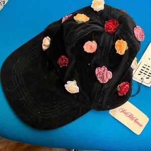 Velvet cap with attached roses